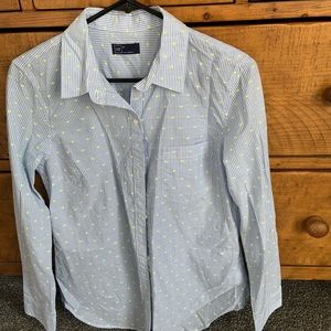 This shirt is in excellent condition. It’s blue striped with small green dots.